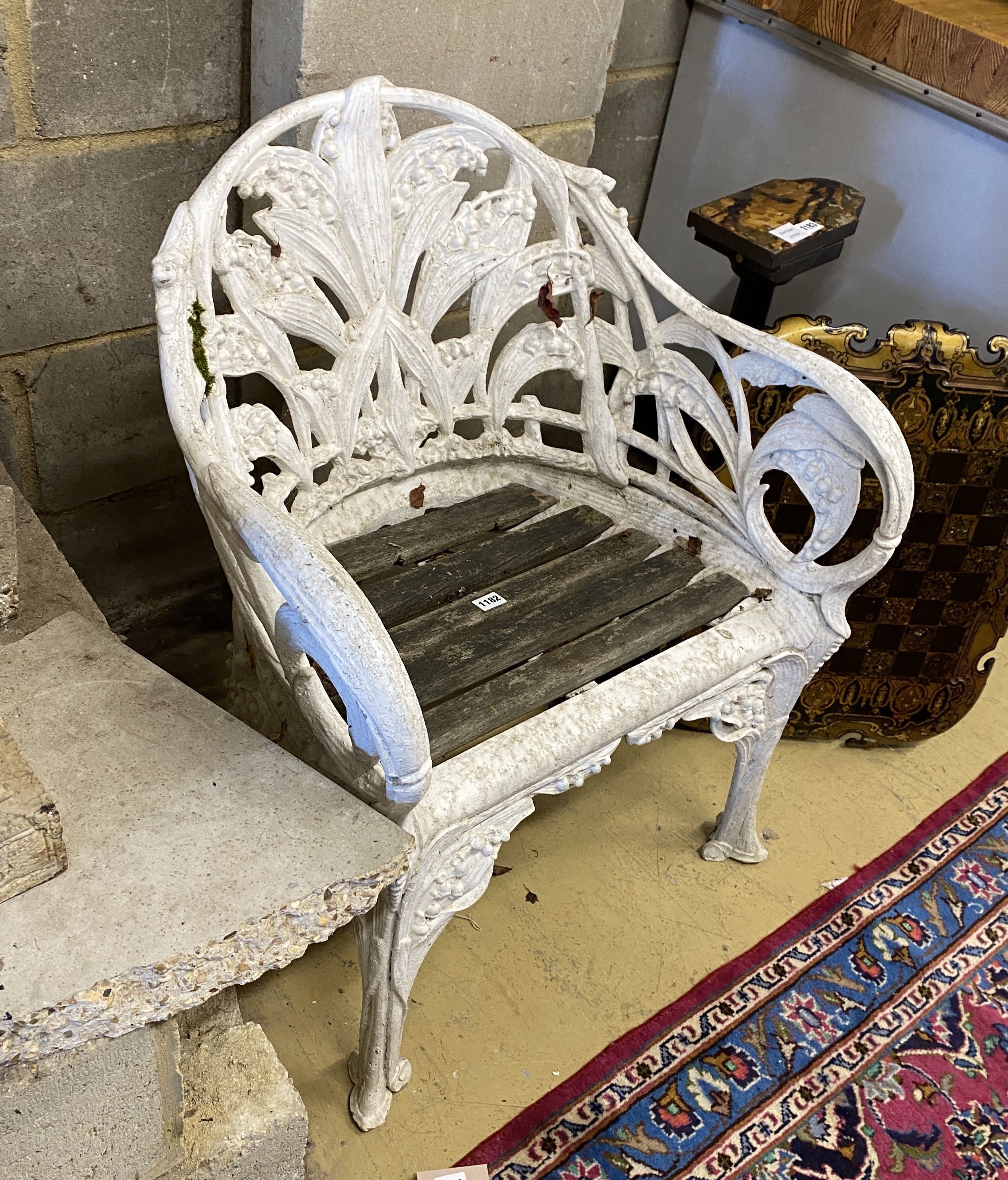 A Coalbrookdale style cast aluminium garden chair with slatted wood seat, width 65cm, depth 52cm, height 80cm